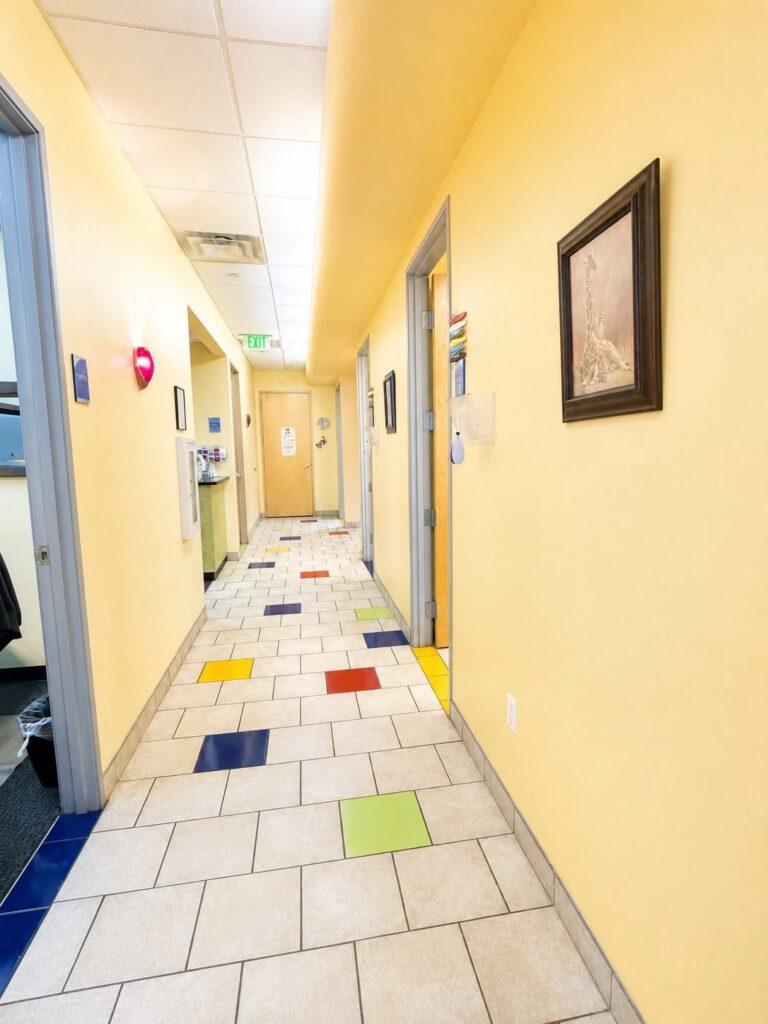 A hallway lined with framed art