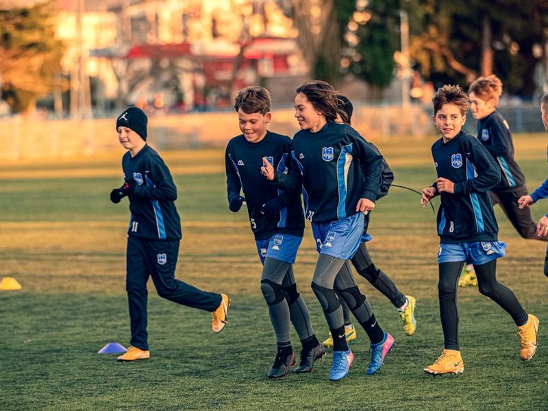Kids running at soccer practice